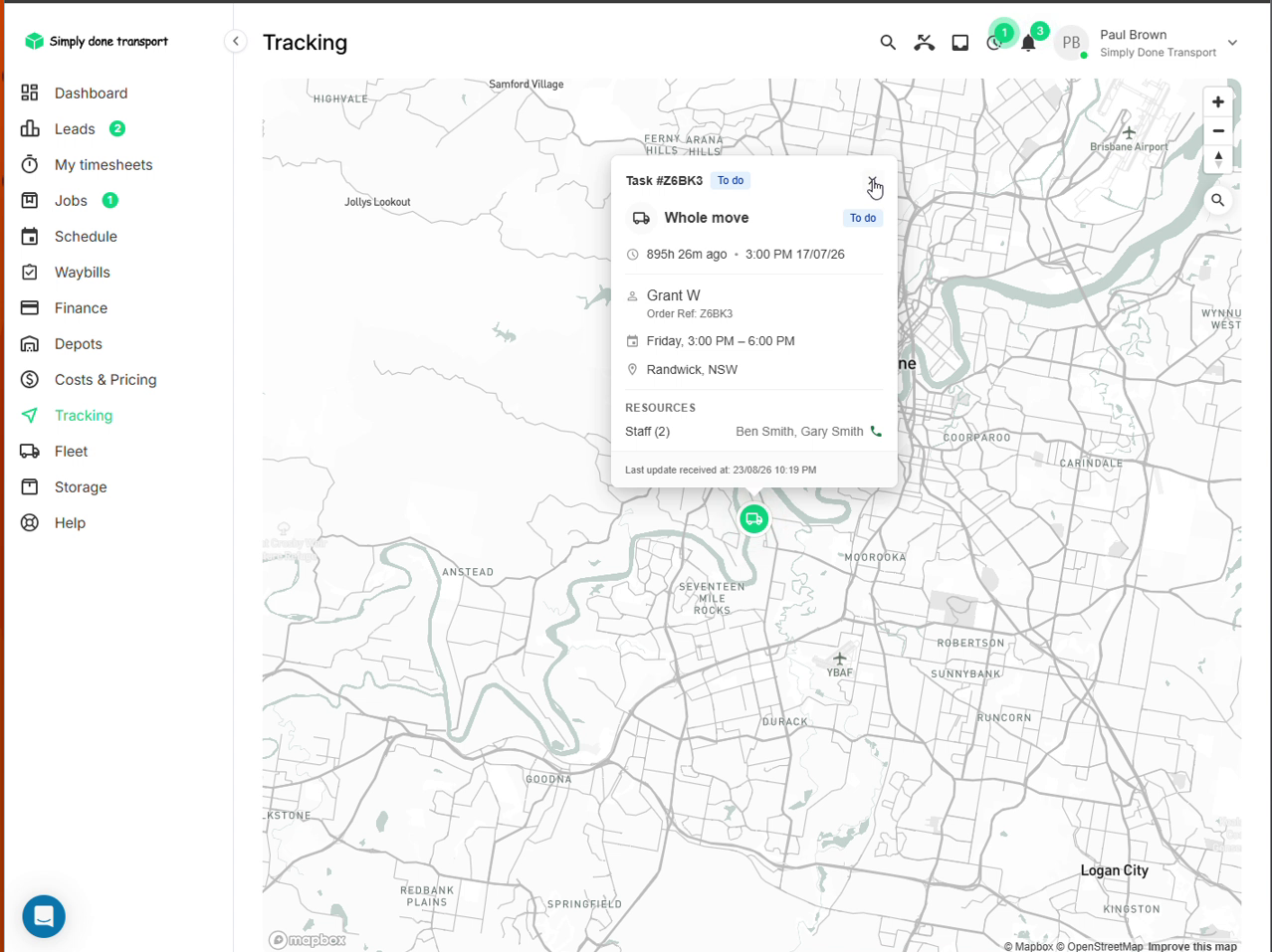 Tracking map with a task popup showing status, schedule window, staff and last update time