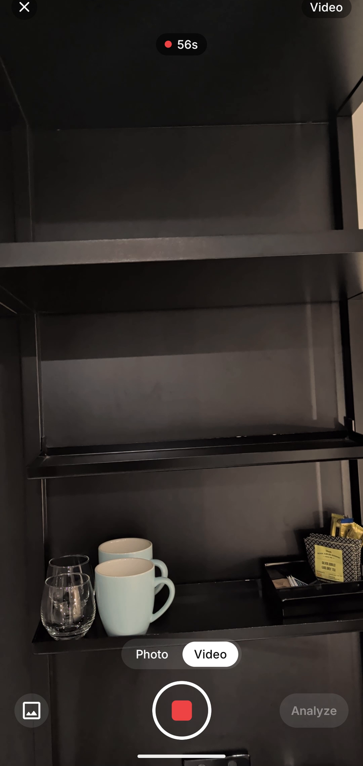 In-app camera recording a video of a room with photo and video modes and an analyze button